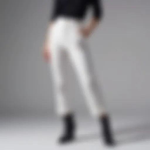 Chic white pants with an elastic waistband styled on a minimalist background